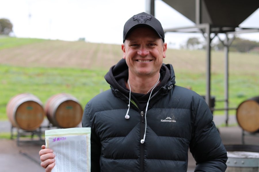 EcoVineyard participant smiling while holding certificate